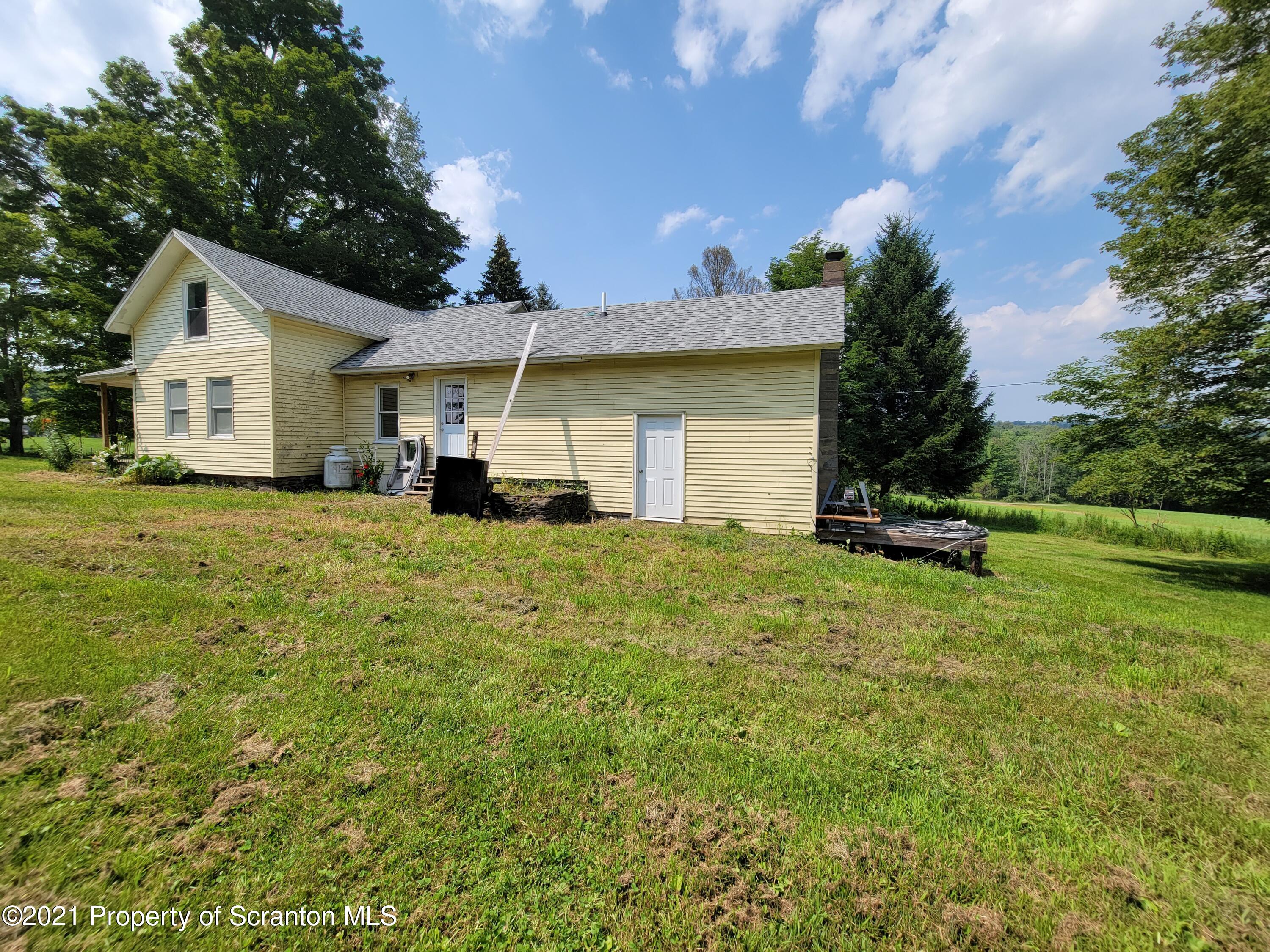 686 Wilcox Road Meshoppen, PA 18630 - Photo 7 of 30 a front view of a house with a yard