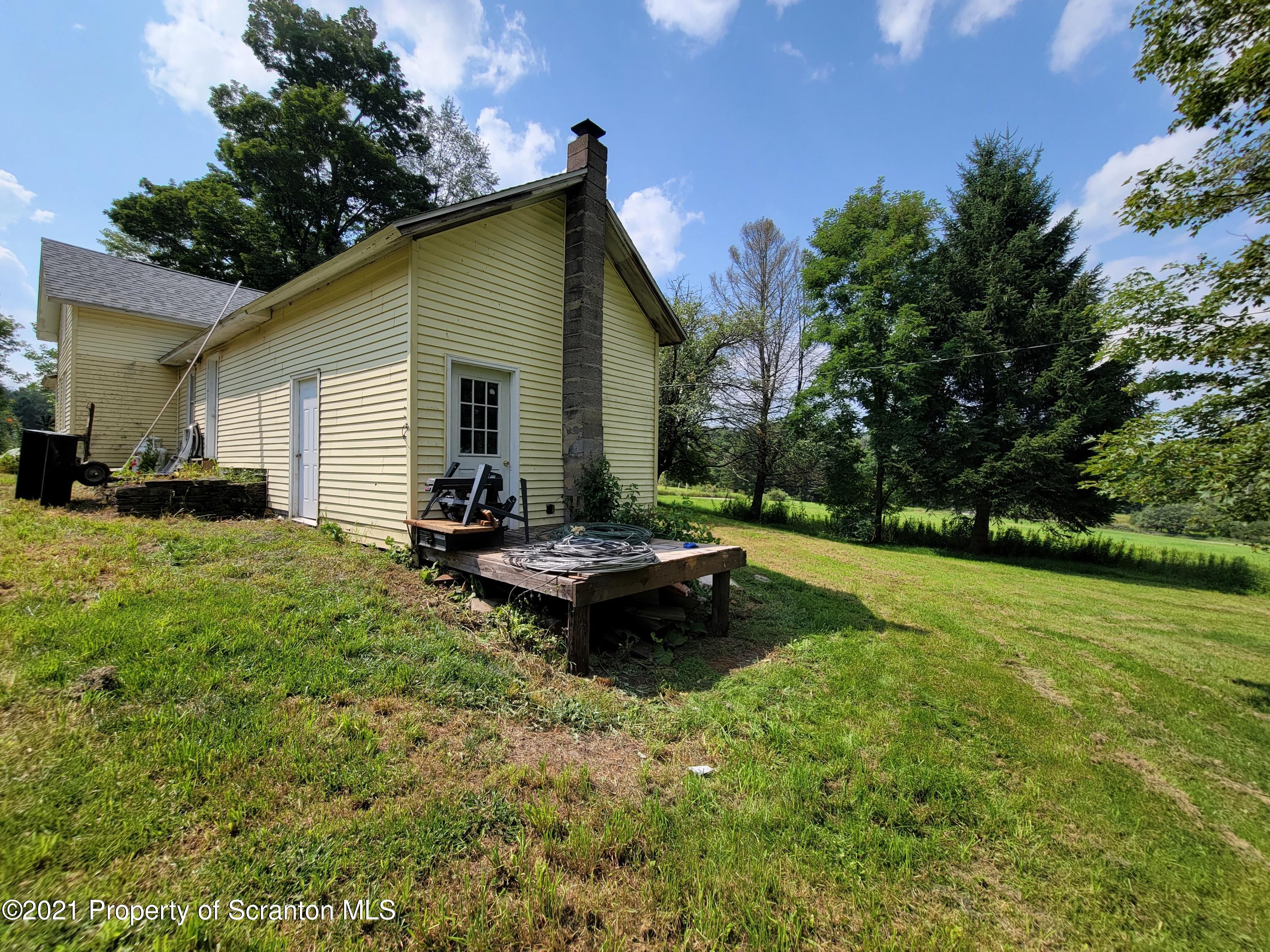 686 Wilcox Road Meshoppen, PA 18630 - Photo 9 of 30 a backyard of a house with table and chairs