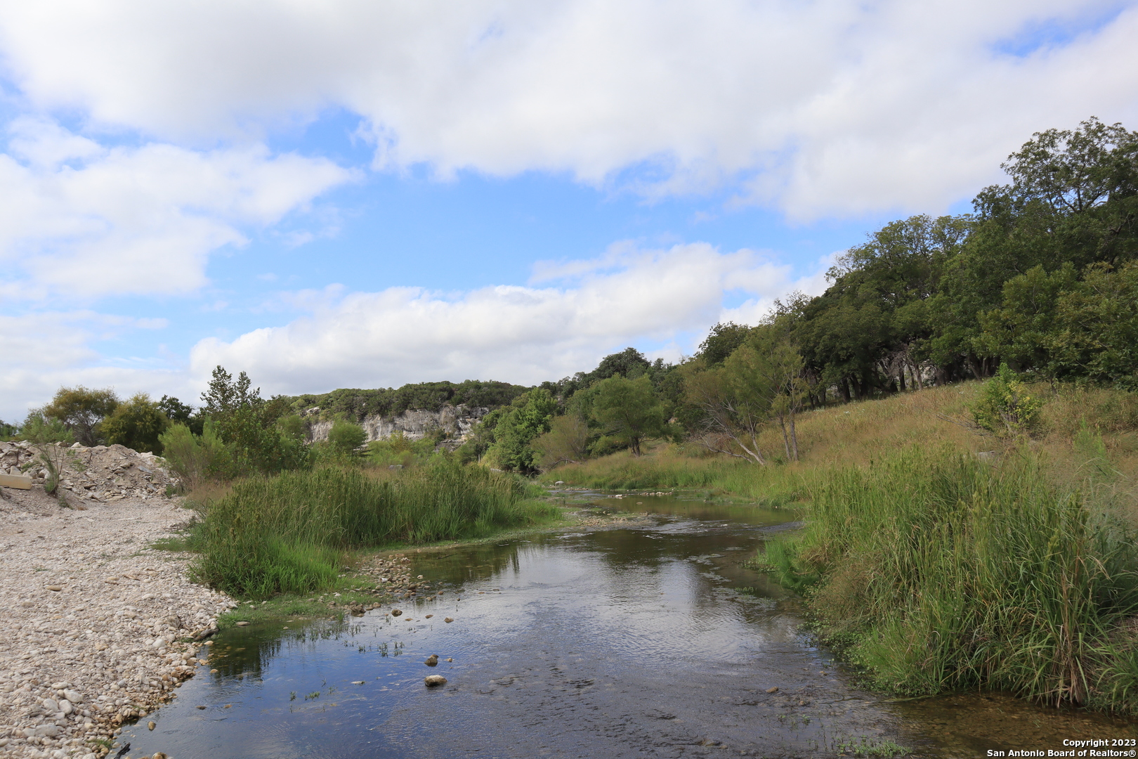 0 Clearwater Canyon Road Bandera, TX 78003 - Photo 3 of 9 a view of a lake with mountains in the background