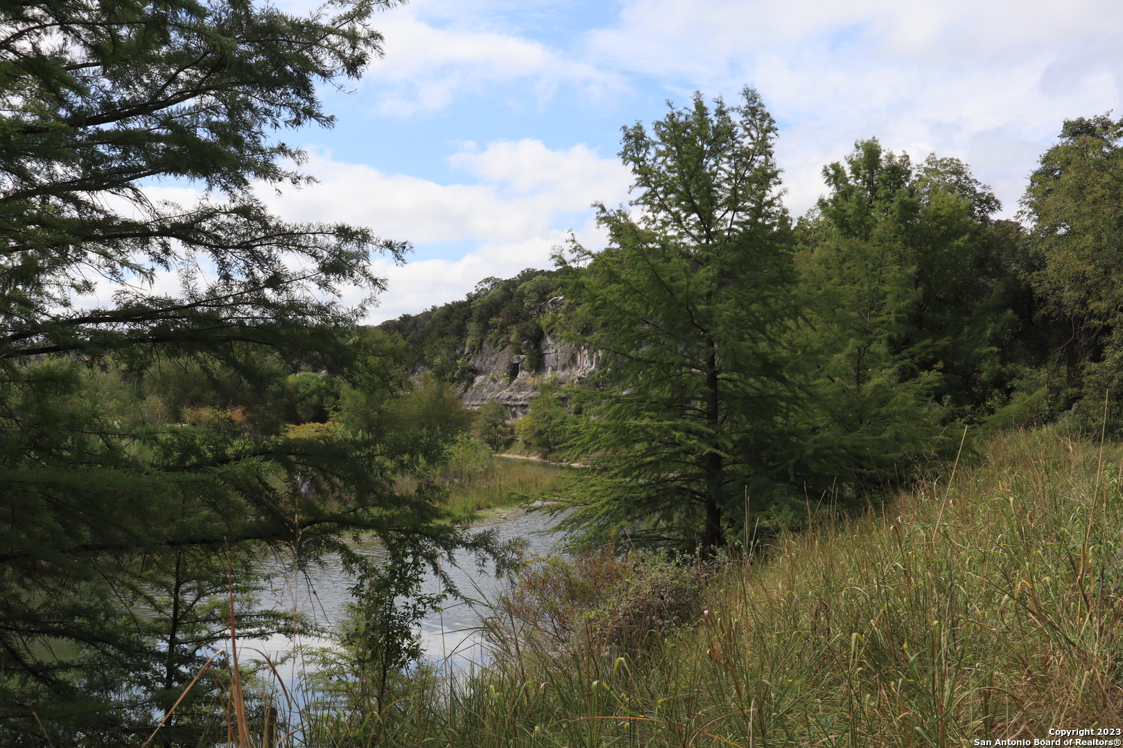 0 Clearwater Canyon Road Bandera, TX 78003 - Photo 8 of 9 a view of a lake with lots of trees