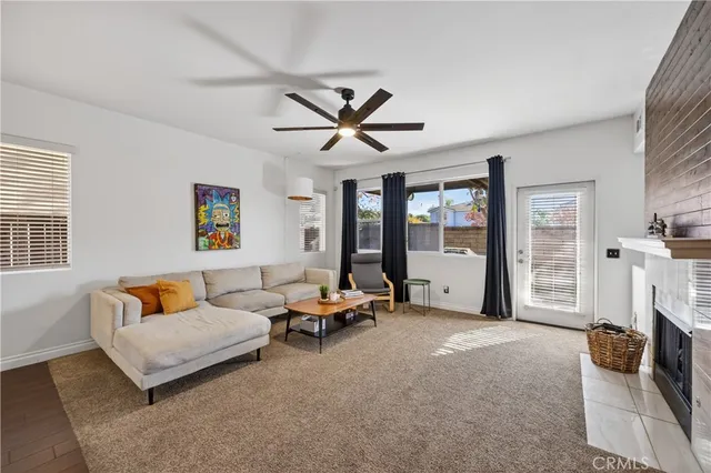 a living room with furniture and a fireplace