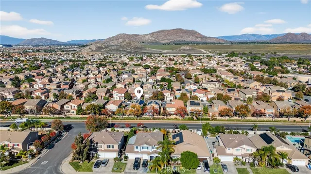 an aerial view of residential building and lake