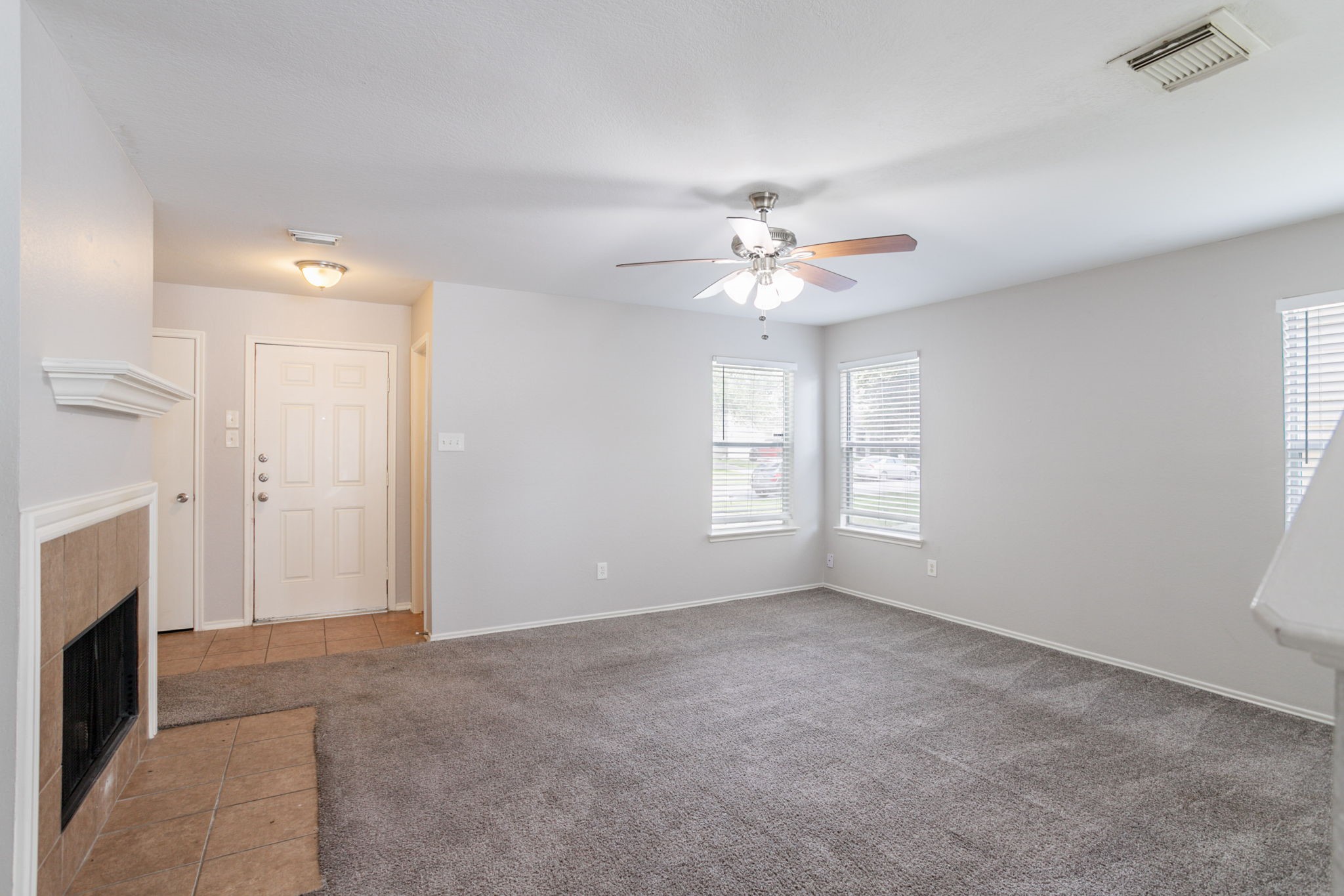 12026 Madison Oak Street Houston, TX 77038 - Photo 13 of 39 a view of livingroom with window