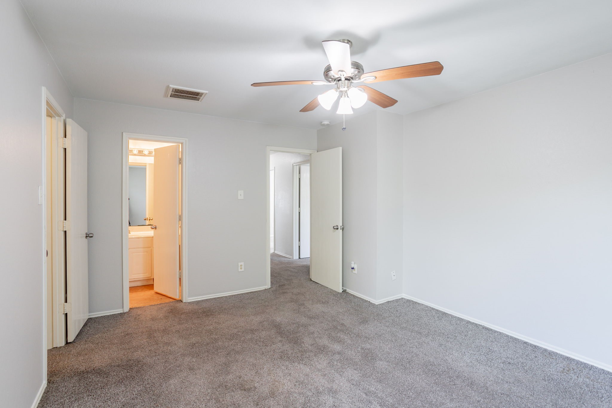 12026 Madison Oak Street Houston, TX 77038 - Photo 22 of 39 a view of an empty room and chandelier fan