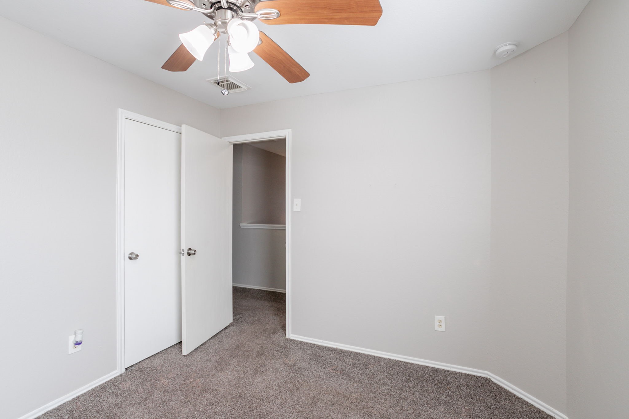 12026 Madison Oak Street Houston, TX 77038 - Photo 29 of 39 a view of an empty room and chandelier fan
