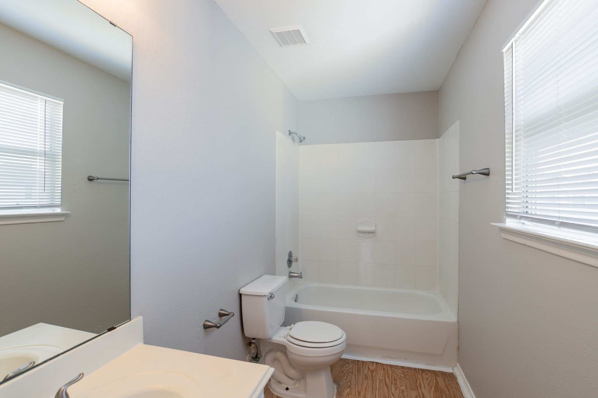 12026 Madison Oak Street Houston, TX 77038 - Photo 31 of 39 a bathroom with a toilet a sink and a bathtub