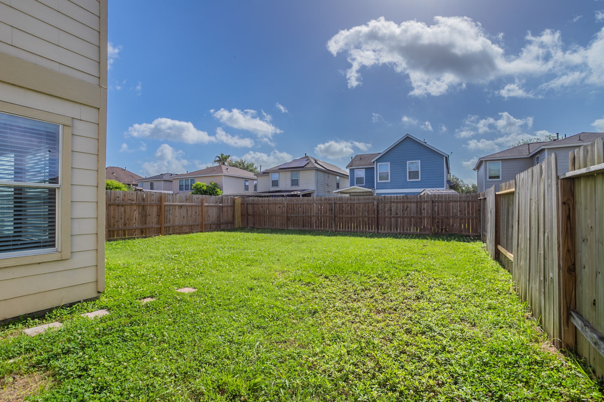 12026 Madison Oak Street Houston, TX 77038 - Photo 33 of 39 a view of a backyard with a garden