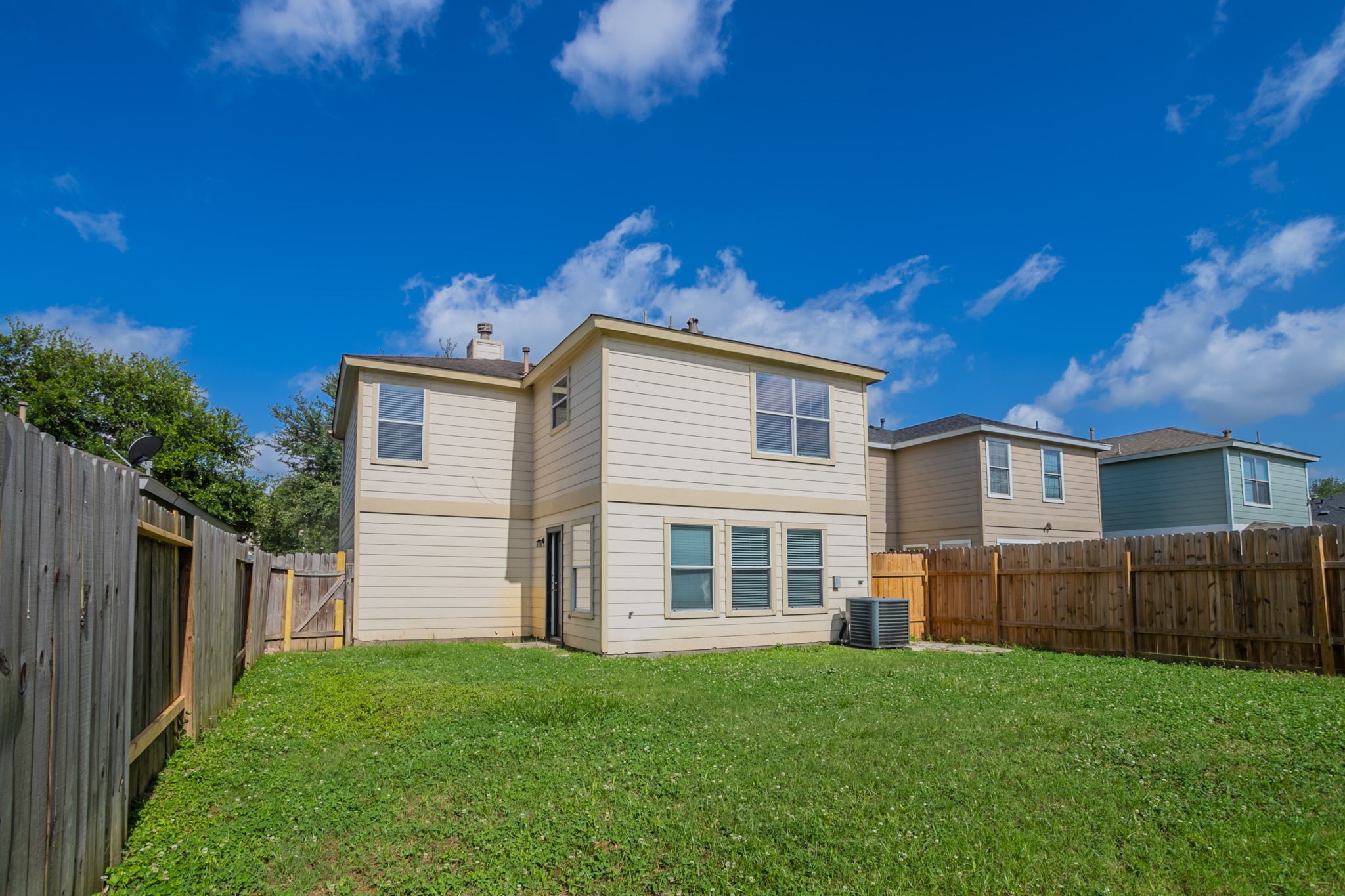 12026 Madison Oak Street Houston, TX 77038 - Photo 34 of 39 a view of a back yard of the house
