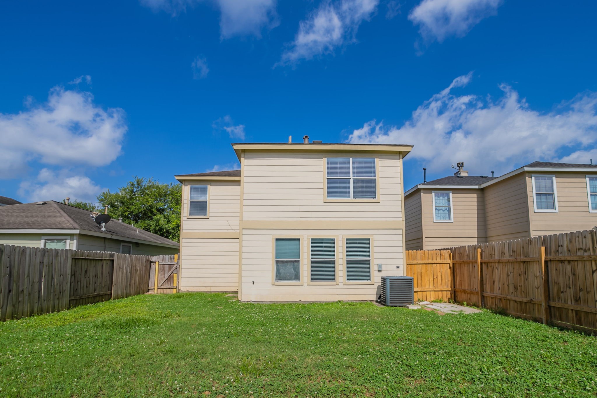 12026 Madison Oak Street Houston, TX 77038 - Photo 35 of 39 a view of a house with a yard