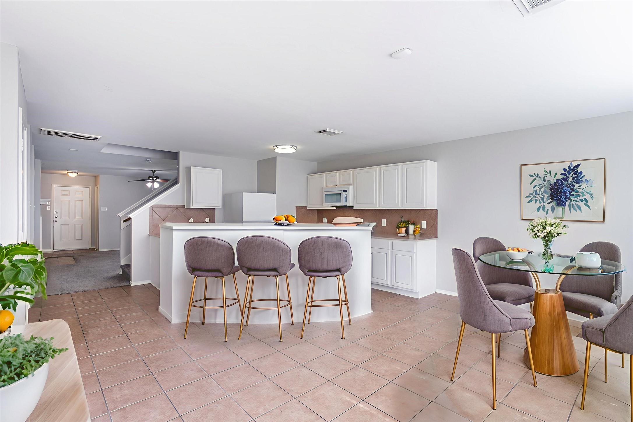 12026 Madison Oak Street Houston, TX 77038 - Photo 4 of 39 a kitchen with cabinets and chairs