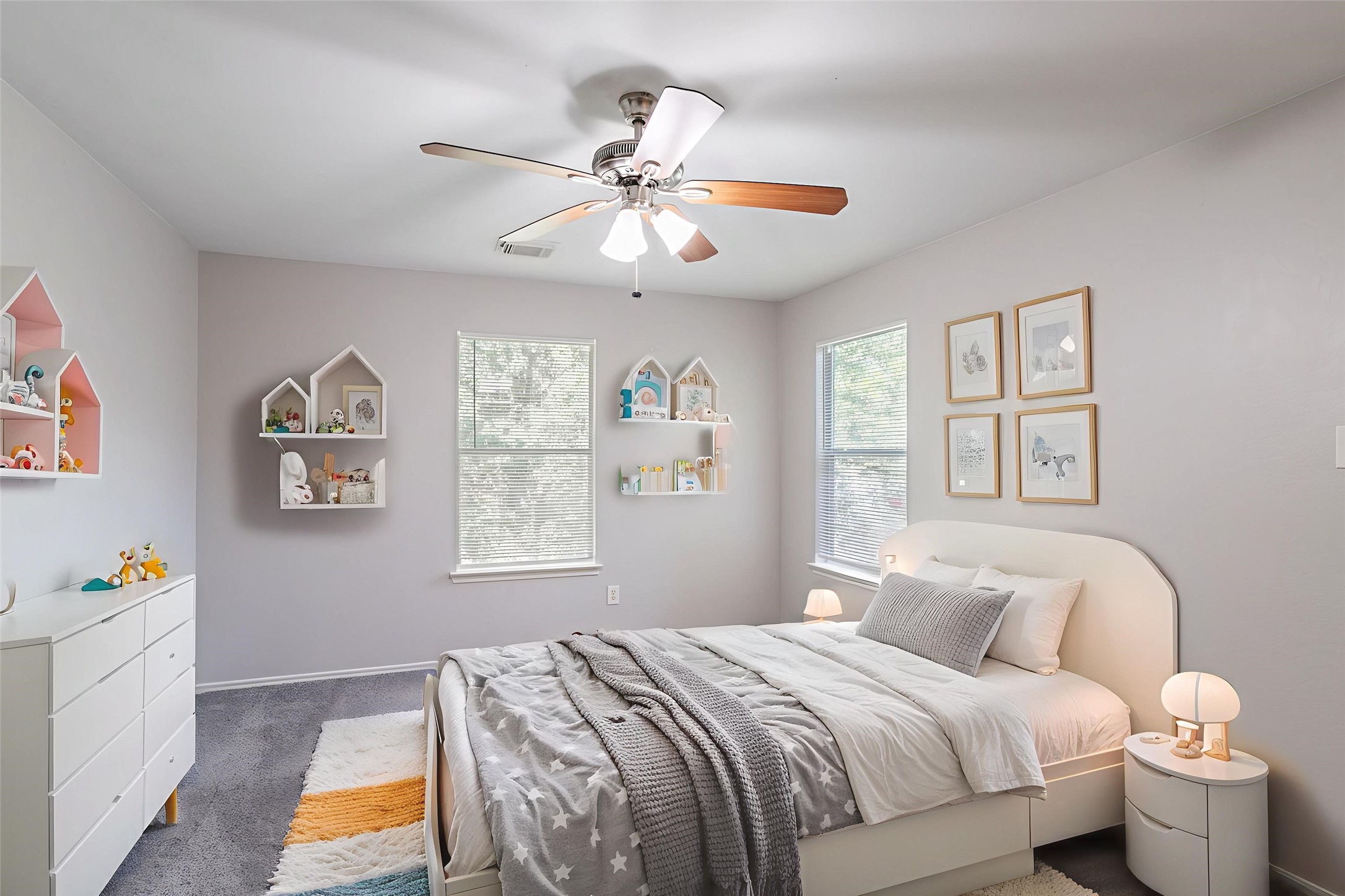 12026 Madison Oak Street Houston, TX 77038 - Photo 8 of 39 a bedroom with a bed and a chandelier