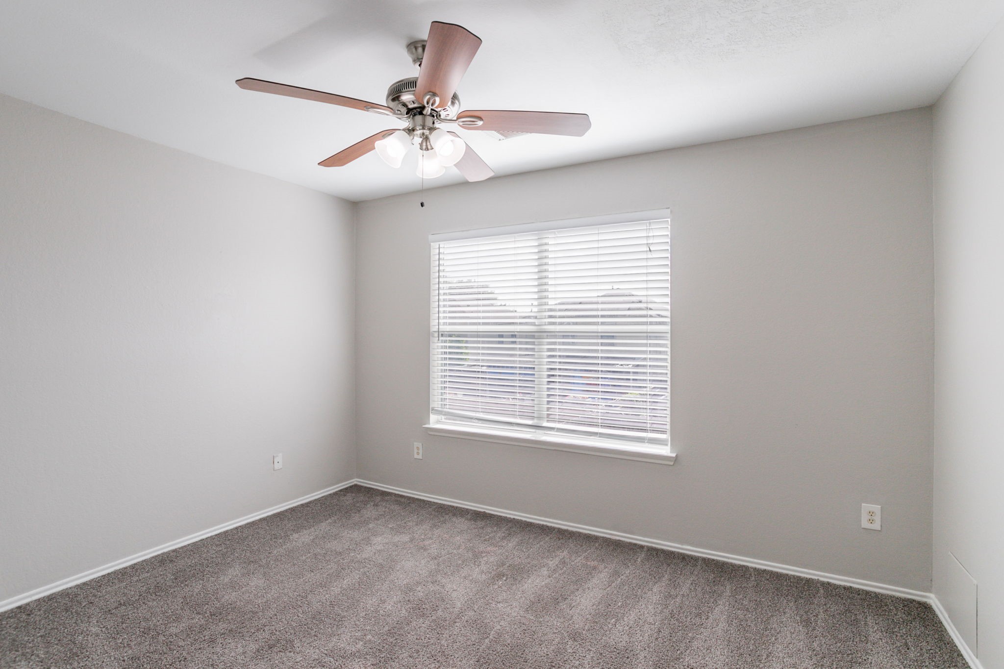 12026 Madison Oak Street Houston, TX 77038 - Photo 10 of 39 a view of an empty room with a window