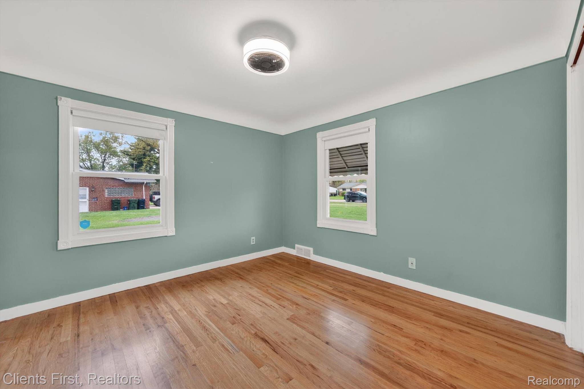 11000 Clinton River Road Sterling Heights, MI 48314 - Photo 22 of 33 Empty room with baseboards and light wood-style flooring