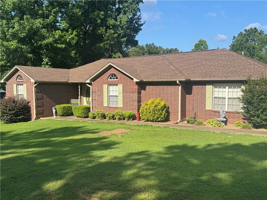 95 Deer Run Road Delaware, AR 72835 - Photo 2 of 40 Brick exterior residence featuring a brown shingle roof