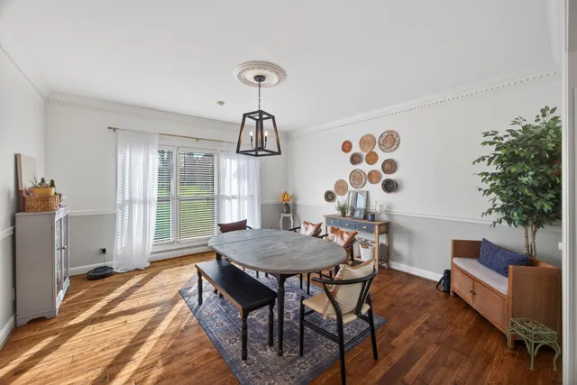 a large kitchen with kitchen island a large counter top space a sink stainless steel appliances and cabinets