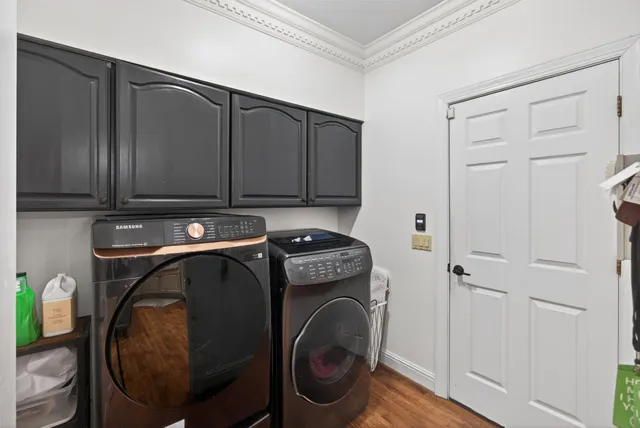 a bedroom with a bed couch and a window