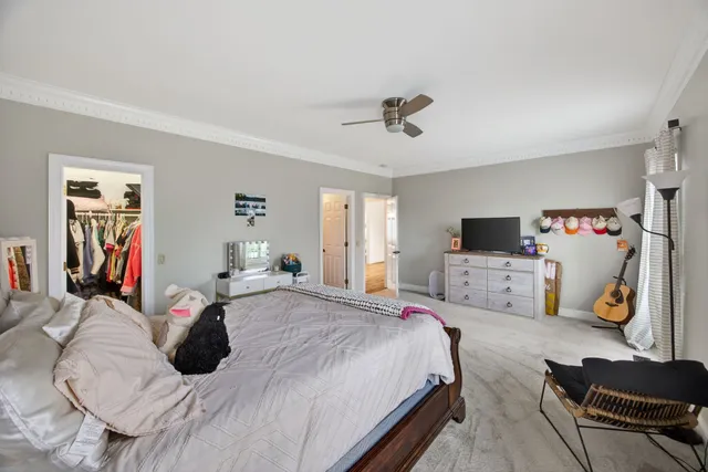 a bathroom with a sink a toilet and shower curtain