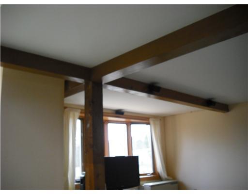 413 Windsor Road Augusta, ME 04330 - Photo 15 of 25 Living Room. Exposed wood beams in...