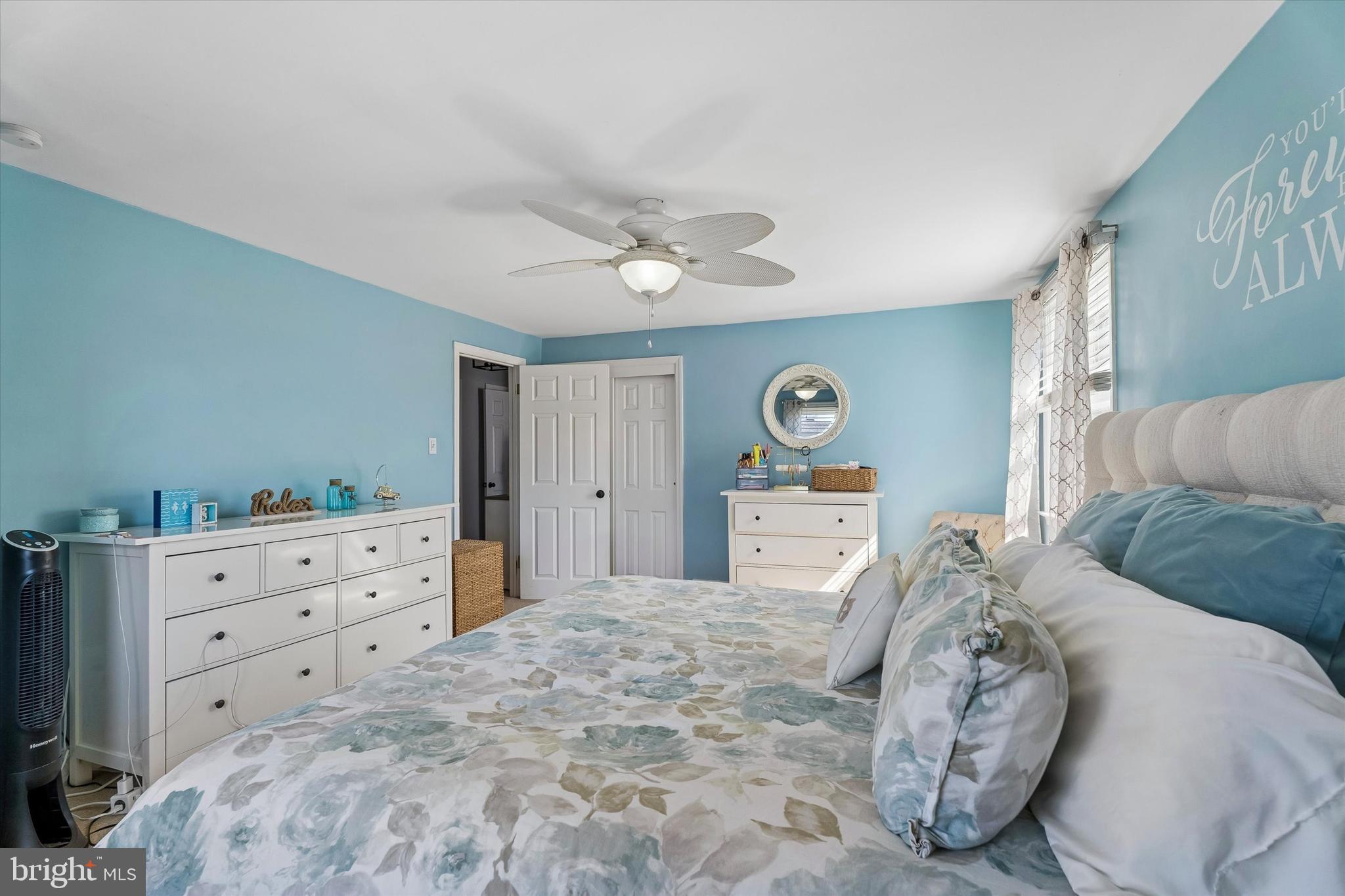 249 Gleaves Road Springfield, PA 19064 - Photo 24 of 34 a bedroom with a bed and a chandelier