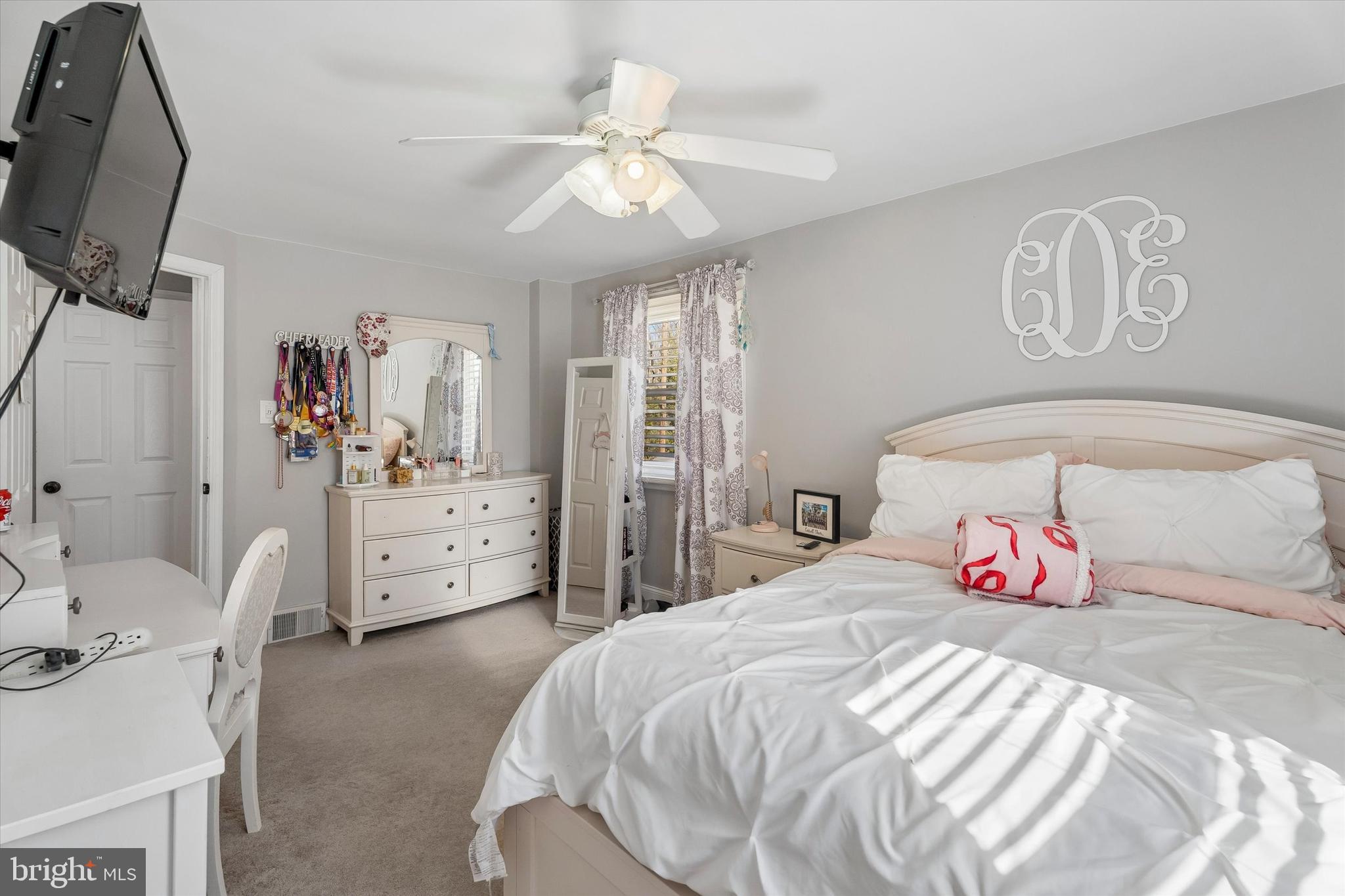 249 Gleaves Road Springfield, PA 19064 - Photo 25 of 34 a bedroom with a bed and a flat tv screen on dresser