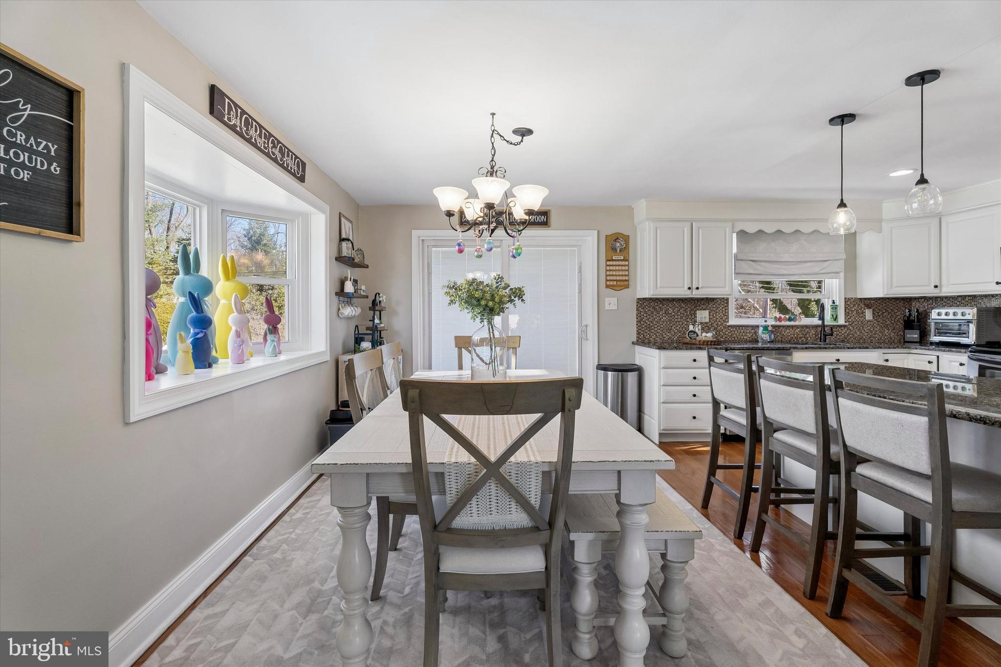 249 Gleaves Road Springfield, PA 19064 - Photo 8 of 34 a dining room with furniture a livingroom and chandelier