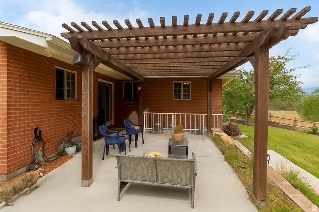 16535 South Redwood Road Riverton, UT 84065 - Photo 44 of 59 Expansive outdoor patio featuring a wood pergola and concrete surface