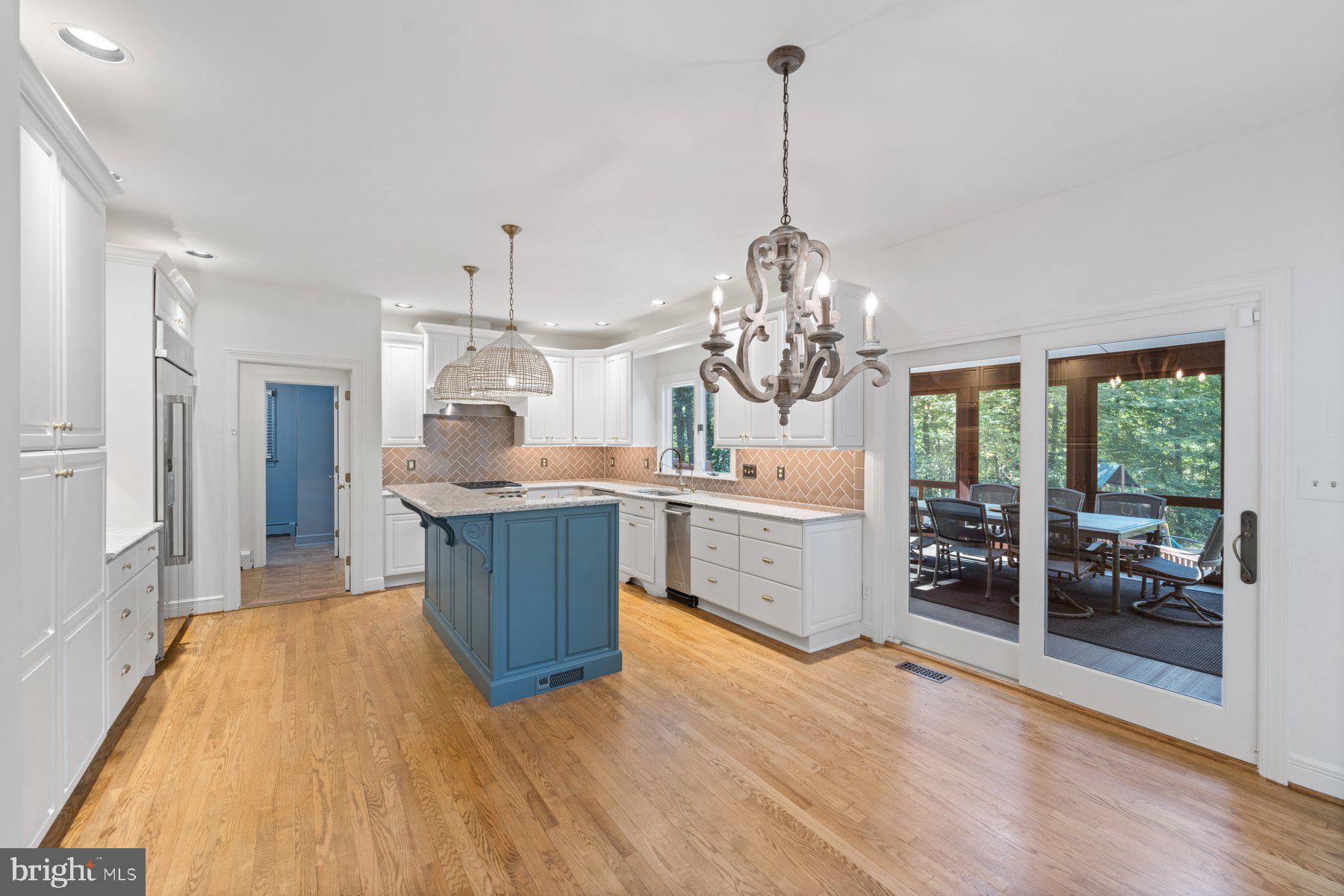 3317 Whitesworth Road Phoenix, MD 21131 - Photo 25 of 67 a large kitchen with sink a refrigerator and wooden cabinets