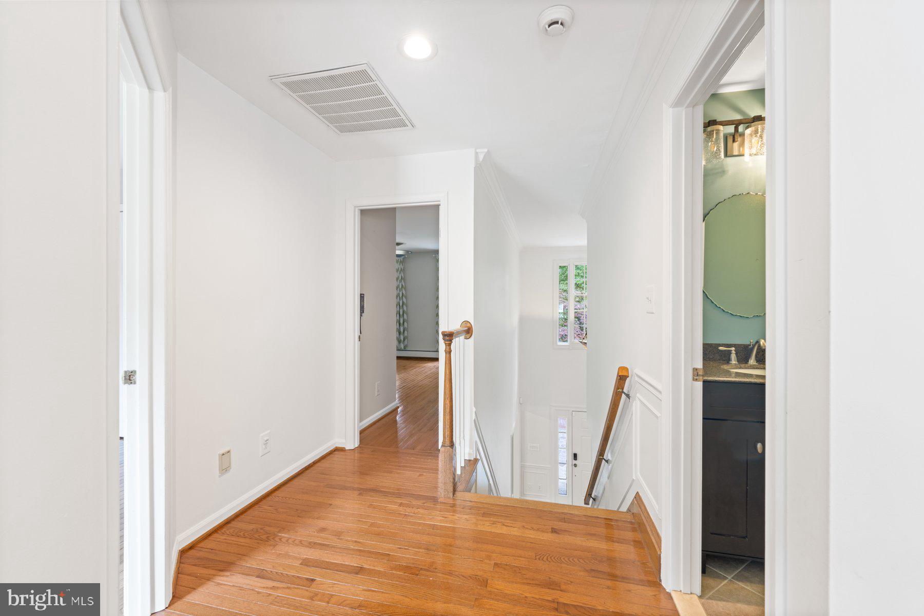 3317 Whitesworth Road Phoenix, MD 21131 - Photo 50 of 67 a view of a hallway with wooden floor and space