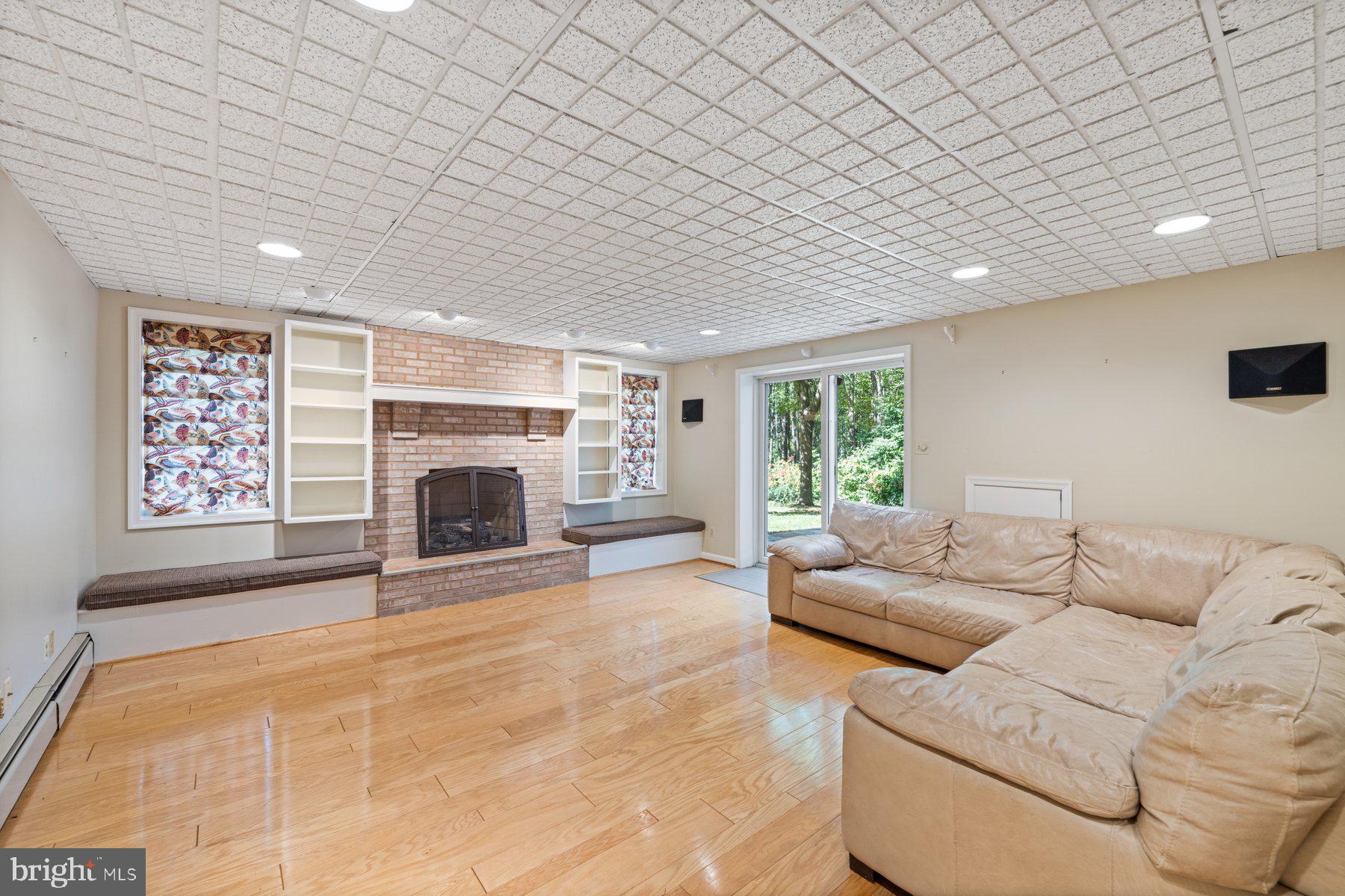 3317 Whitesworth Road Phoenix, MD 21131 - Photo 54 of 67 a living room with furniture window and a fireplace