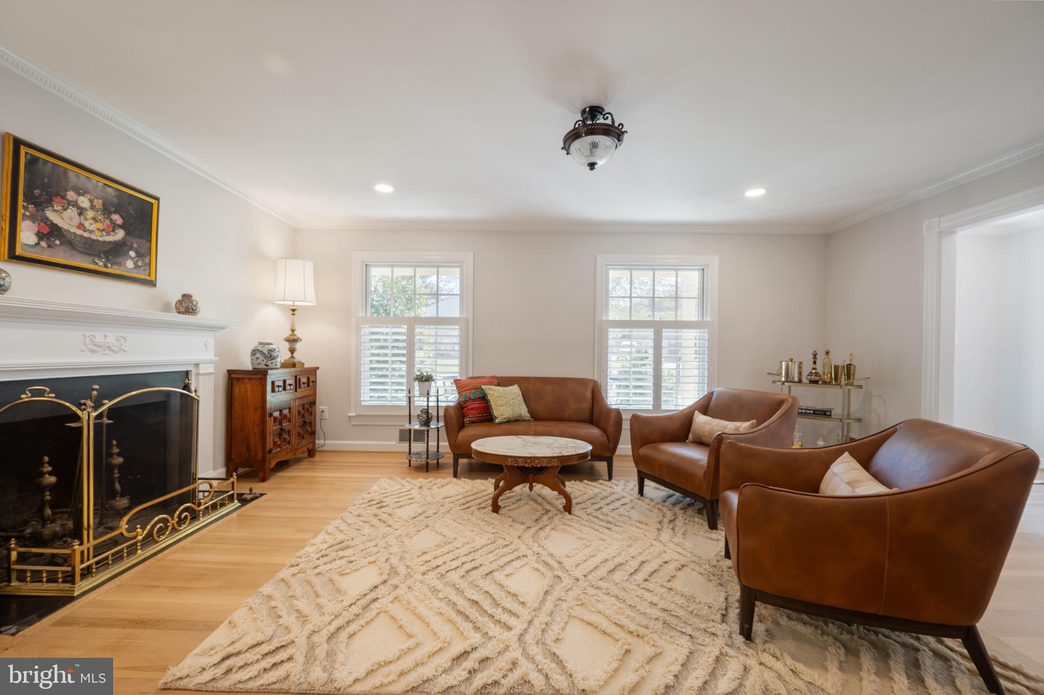 902 Emerald Drive Alexandria, VA 22308 - Photo 23 of 97 a living room with furniture windows and a fireplace