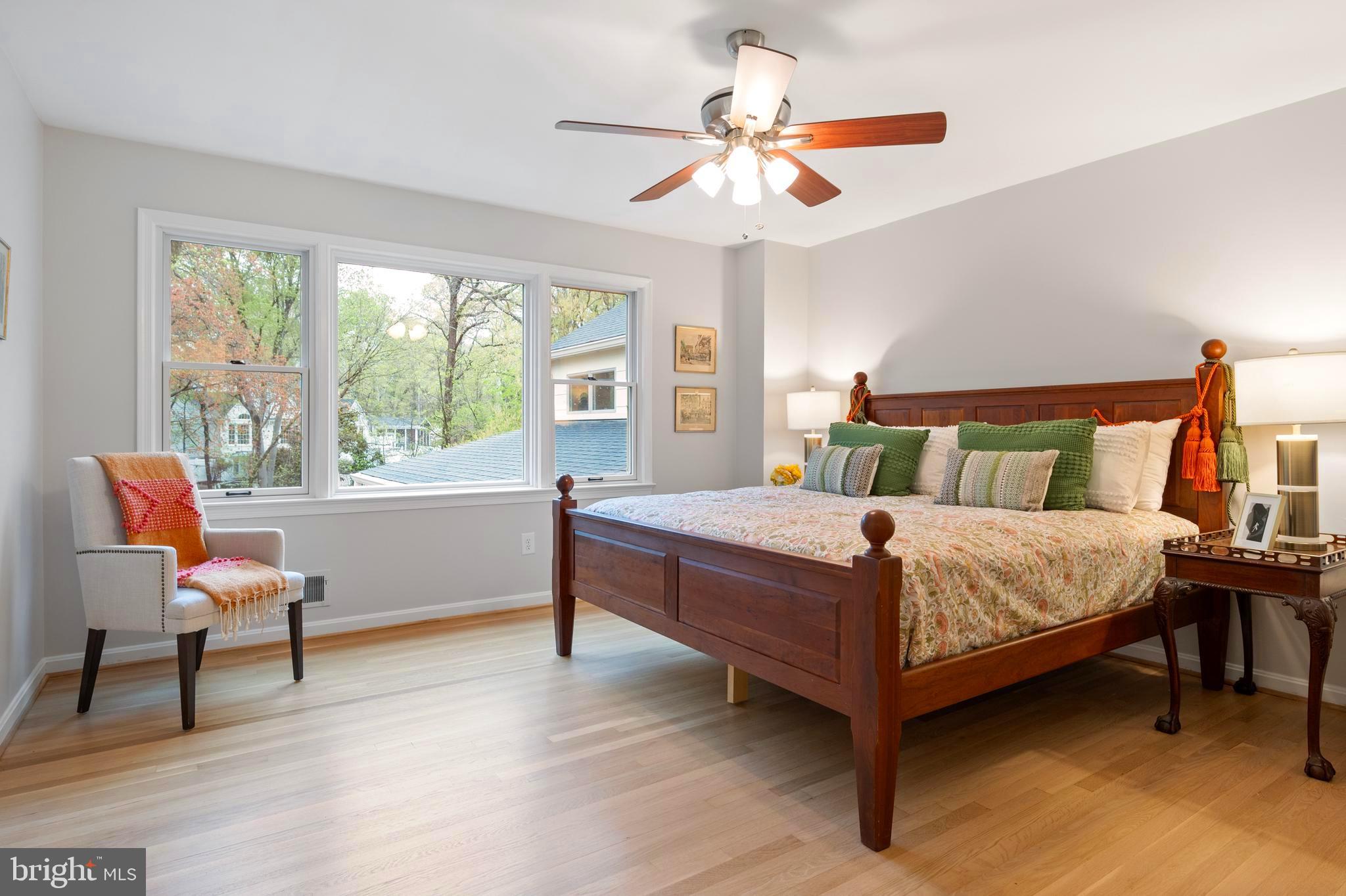 902 Emerald Drive Alexandria, VA 22308 - Photo 26 of 97 a bedroom with a bed and a chandelier