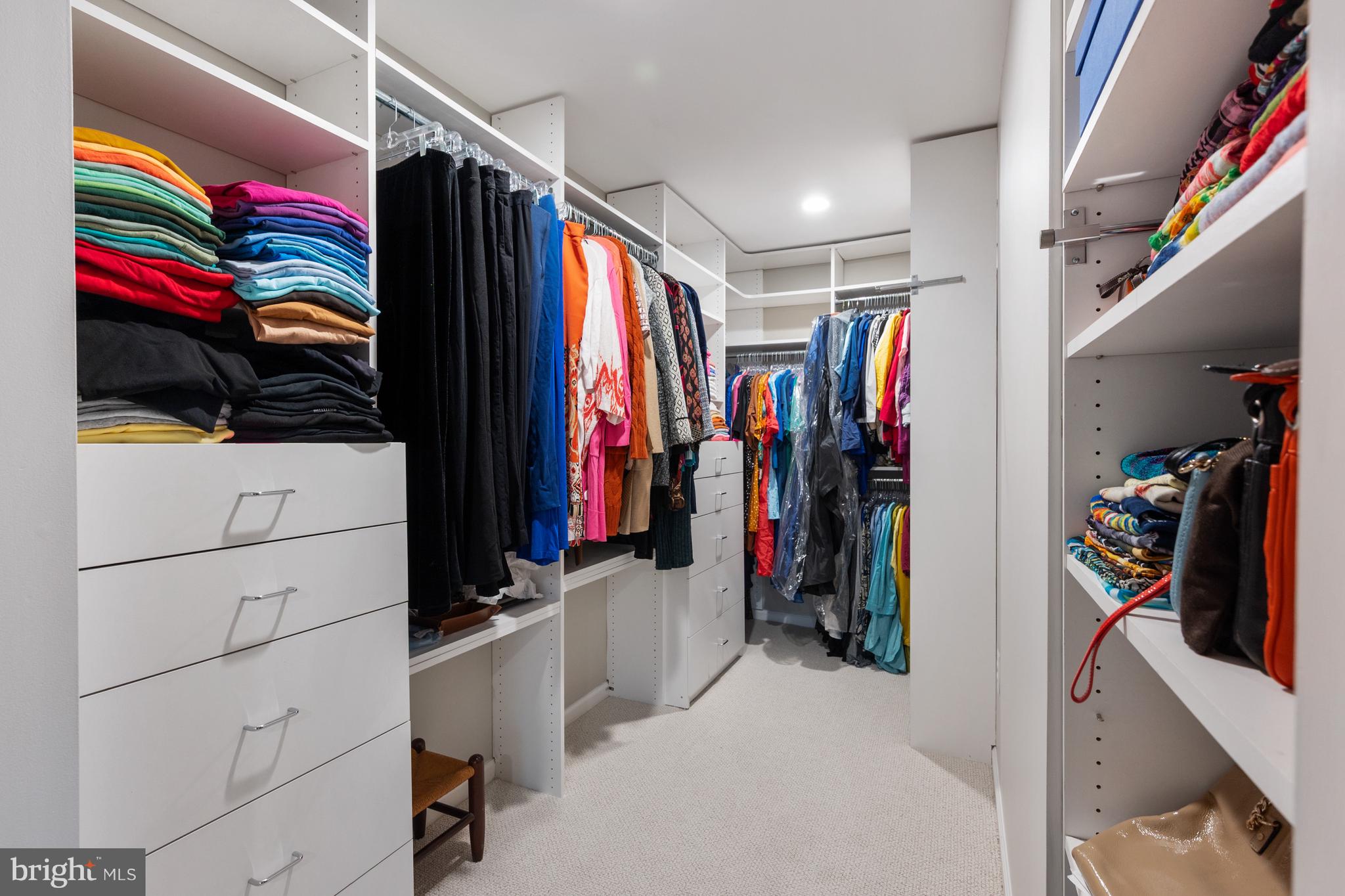 902 Emerald Drive Alexandria, VA 22308 - Photo 33 of 97 a view of walk in closet with clothes