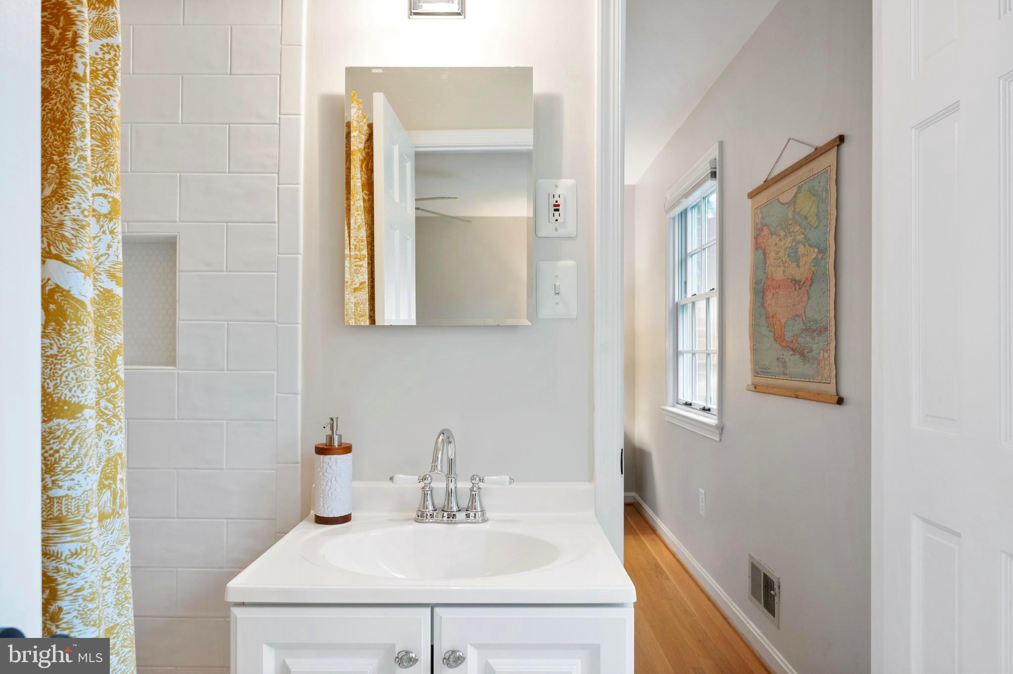 902 Emerald Drive Alexandria, VA 22308 - Photo 35 of 97 a bathroom with a sink and a mirror