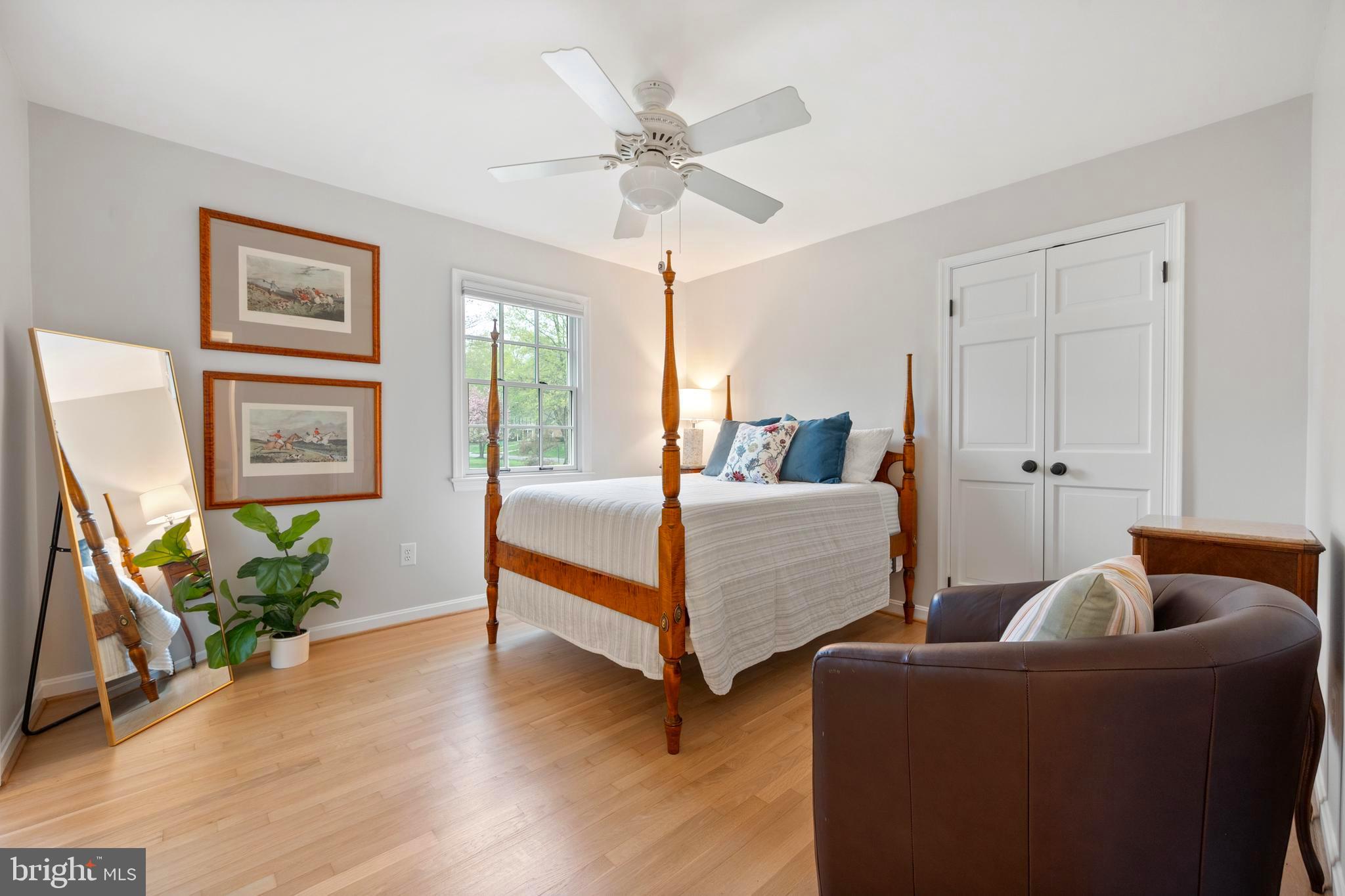 902 Emerald Drive Alexandria, VA 22308 - Photo 36 of 97 a bedroom with a bed and wooden floor