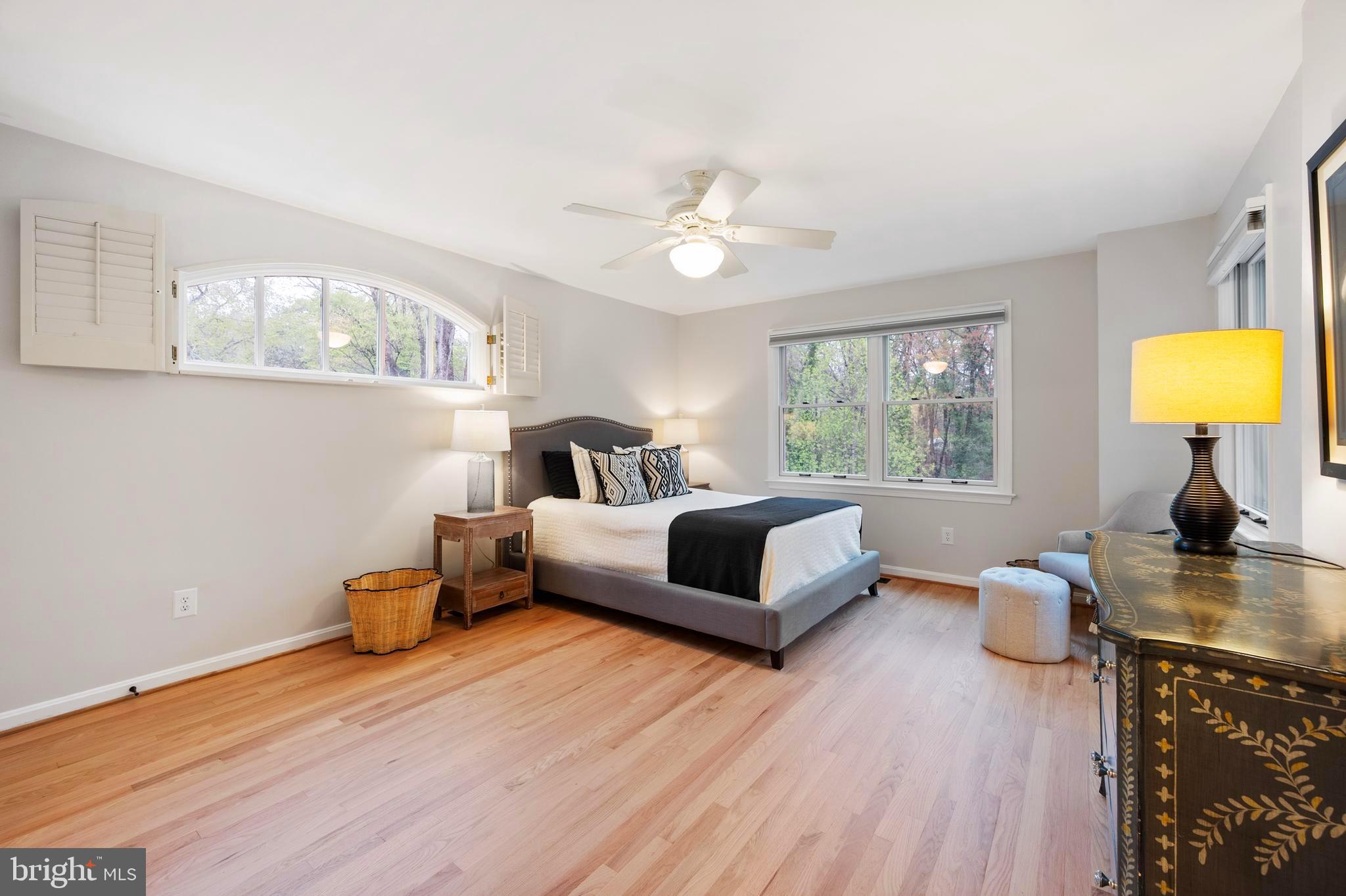902 Emerald Drive Alexandria, VA 22308 - Photo 40 of 97 a bedroom with a bed couch chandelier and a window