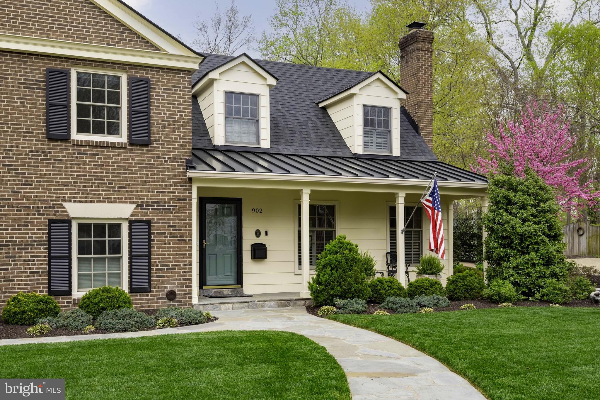 902 Emerald Drive Alexandria, VA 22308 - Photo 4 of 97 a front view of a house with a yard