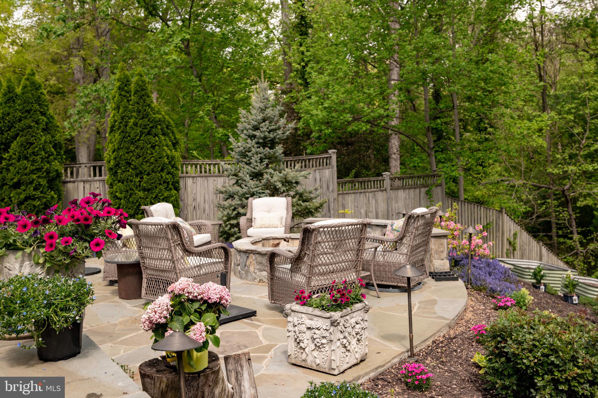 902 Emerald Drive Alexandria, VA 22308 - Photo 69 of 97 a view of a patio with table and chairs and potted plants