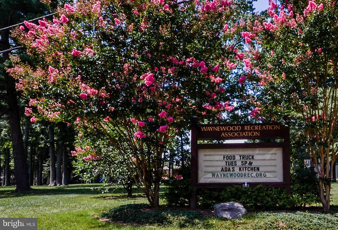 902 Emerald Drive Alexandria, VA 22308 - Photo 97 of 97 a sign that is sitting in front of a tree