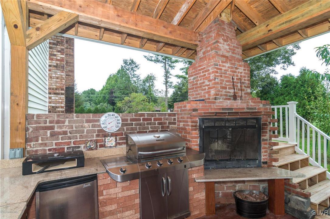 366 Evergreen Hollow Road Effort, PA 18330 - Photo 9 of 47 Outdoor Fireplace & Kitchen