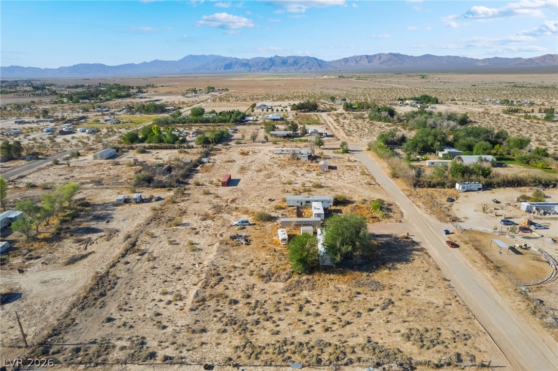 2350 Shawnee Street Sandy Valley, NV 89019 - Photo 20 of 38 Aerial view of sparsely populated area featuring a desert landscape and a mountain backdrop