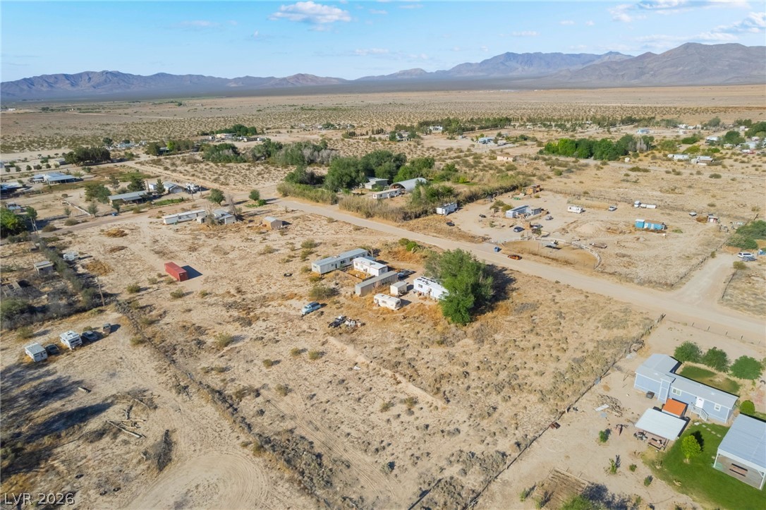 2350 Shawnee Street Sandy Valley, NV 89019 - Photo 22 of 38 Aerial view of property and surrounding area featuring a desert landscape and rural landscape