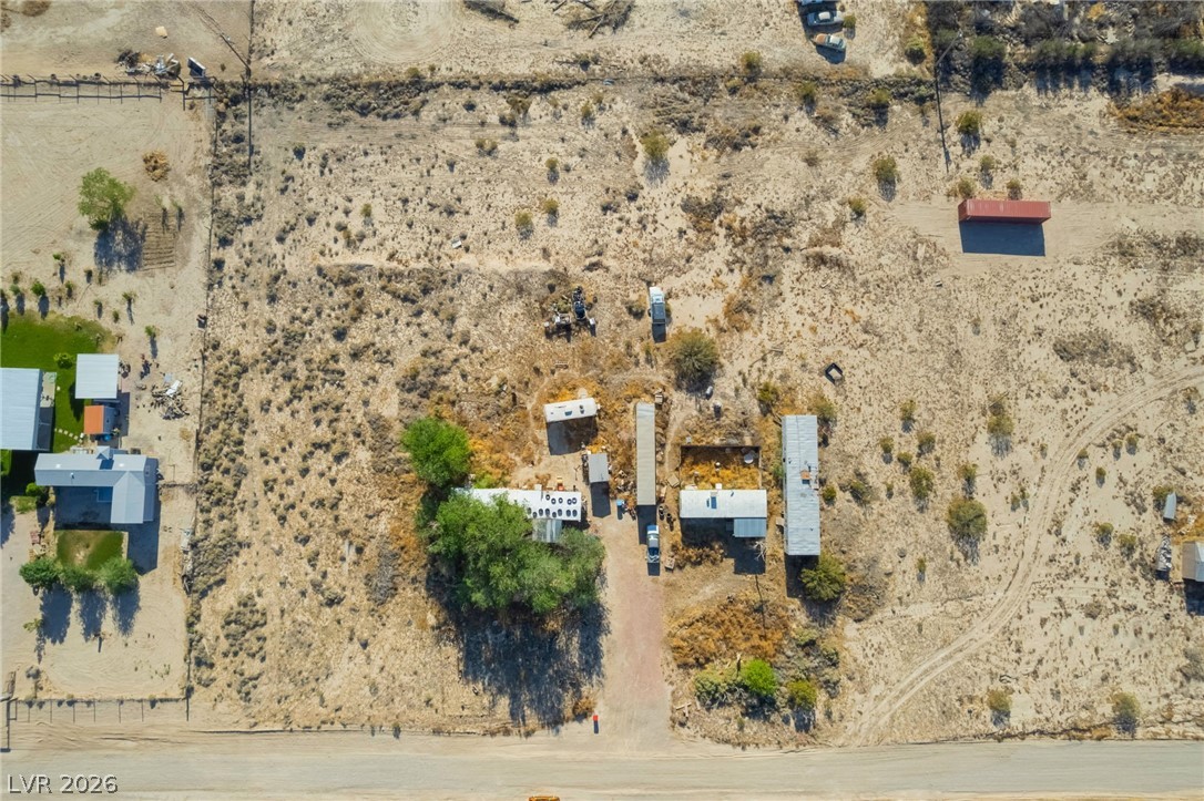 2350 Shawnee Street Sandy Valley, NV 89019 - Photo 26 of 38 Aerial view of property and surrounding area featuring a desert landscape and rural landscape