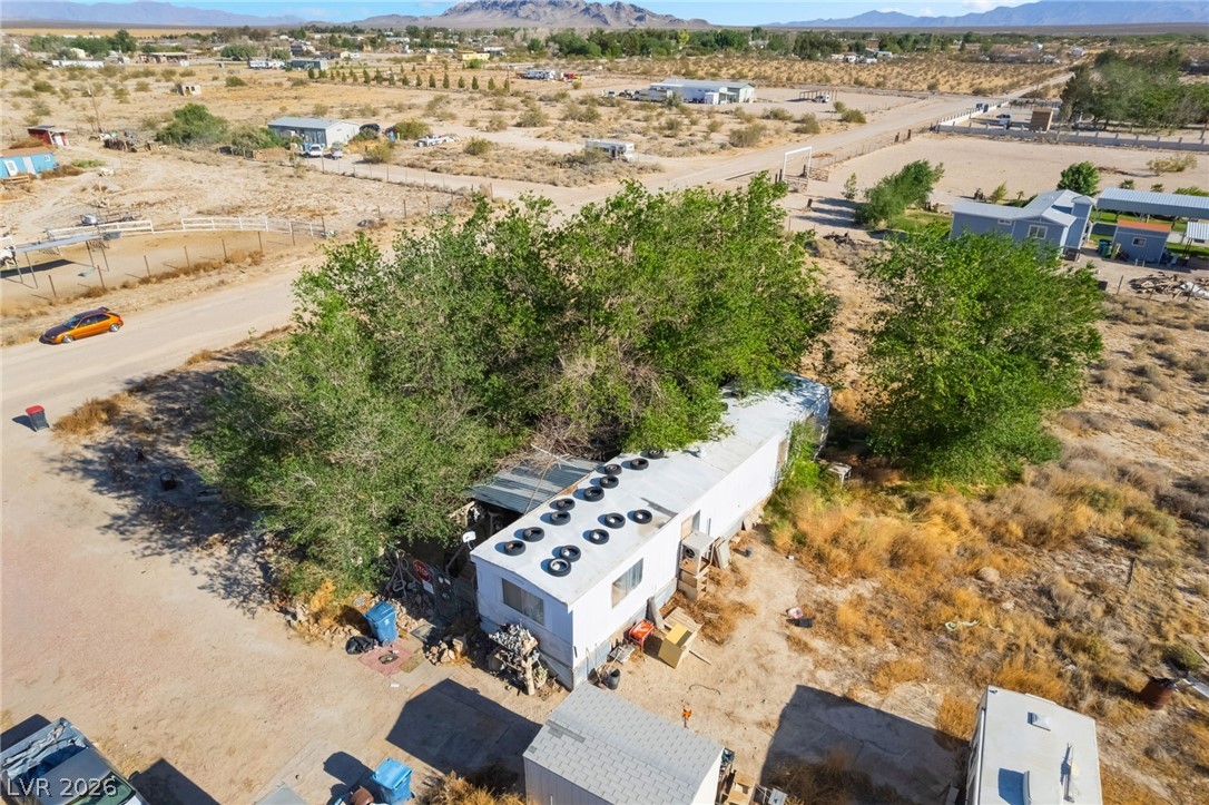 2350 Shawnee Street Sandy Valley, NV 89019 - Photo 10 of 38 Aerial view of sparsely populated area featuring mountains and a desert landscape