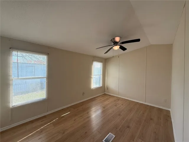 a view of kitchen with sink and wooden floor