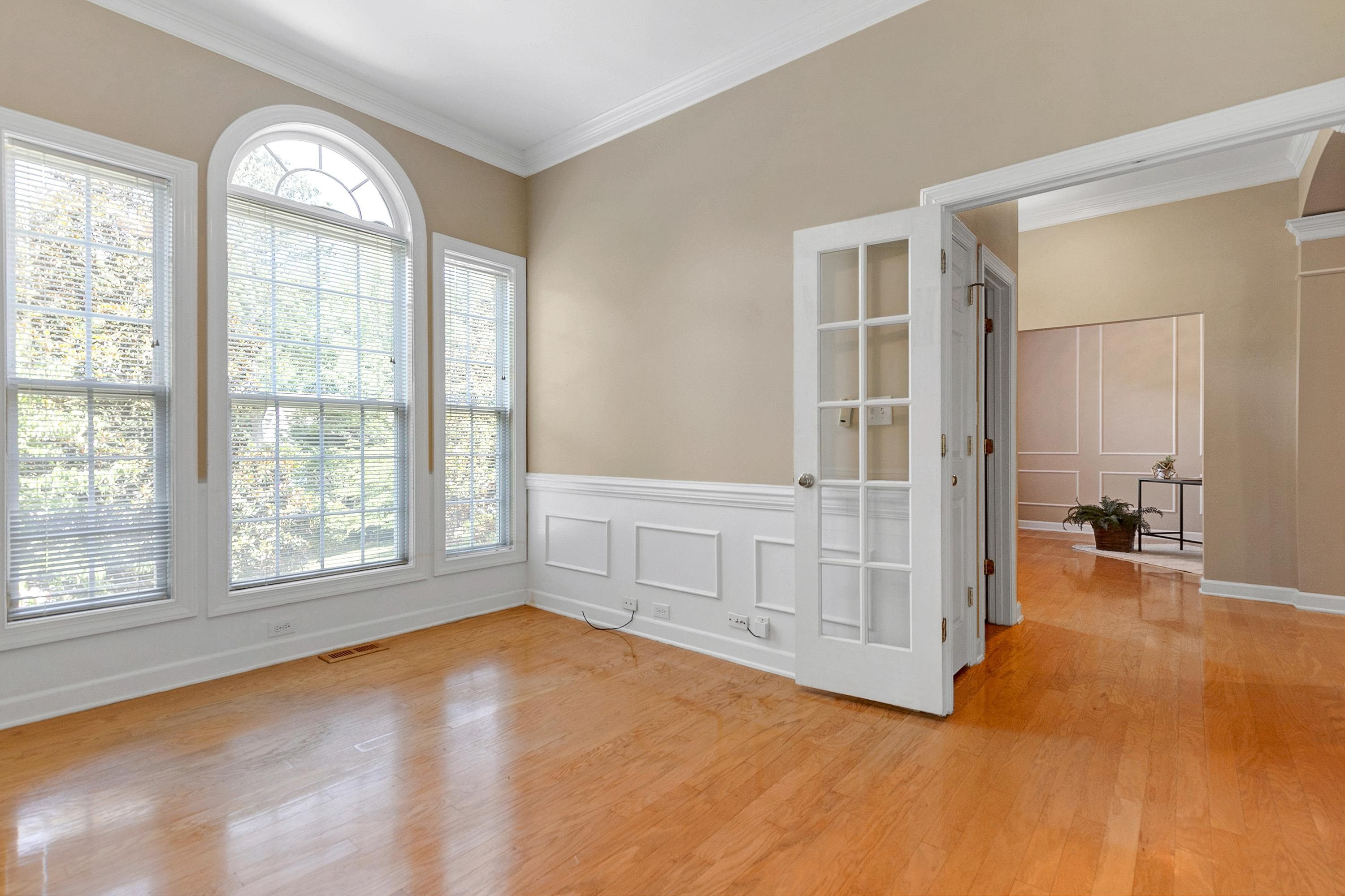 5033 Bartons Enclave Lane Raleigh, NC 27613 - Photo 57 of 58 Office or flex space with French doors and wainscoting. Flexible floor plan with two rooms on the front of the home (one of the left and one on the right) that can be used as an office, living room or flex space. Office
