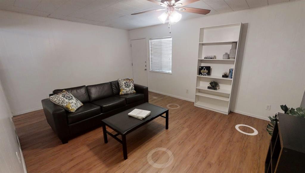 3011 Whitis Avenue, Unit 204 Austin, TX 78705 - Photo 3 of 6 Living room with light wood-style flooring, a ceiling fan, and built in features