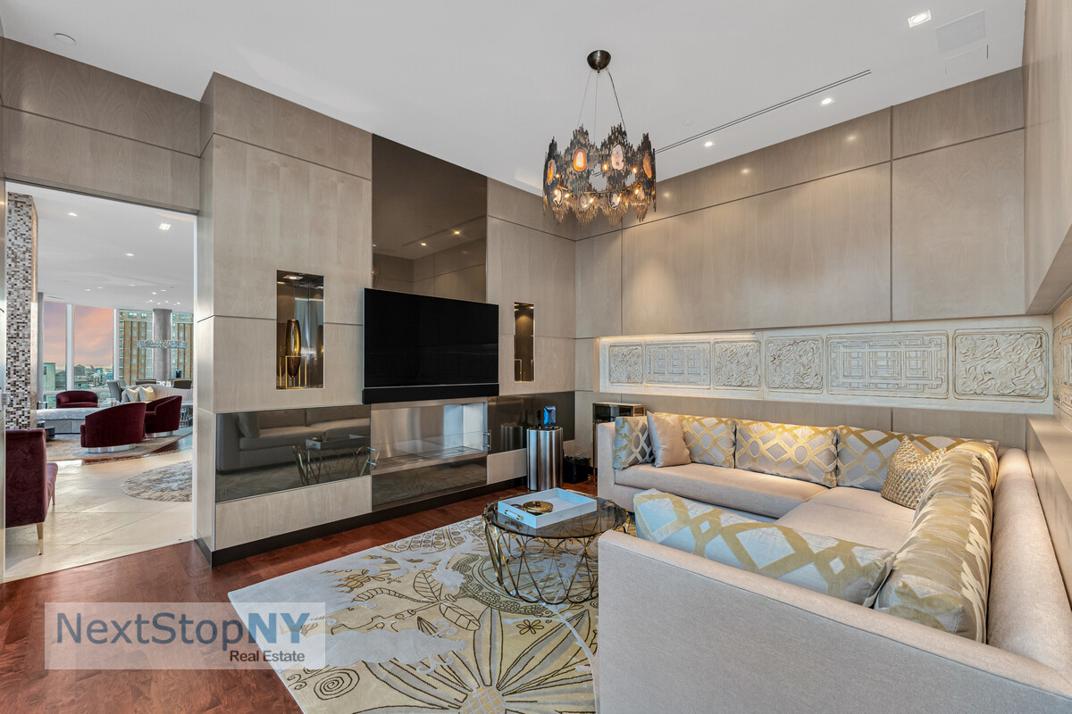 445 Lafayette Street, Unit PH17 Manhattan, NY 10003 - Photo 10 of 12 a living room with furniture a flat screen tv and kitchen view