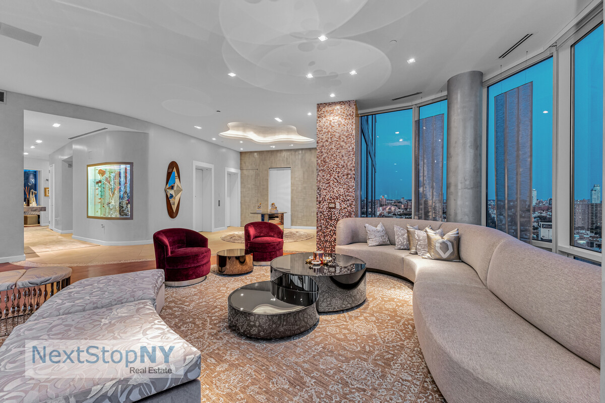 445 Lafayette Street, Unit PH17 Manhattan, NY 10003 - Photo 3 of 12 a living room with furniture and a large window