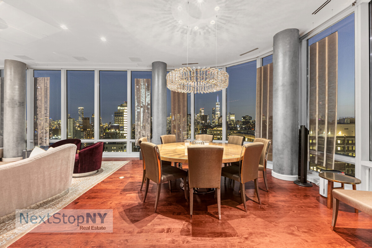 445 Lafayette Street, Unit PH17 Manhattan, NY 10003 - Photo 4 of 12 a dining room with furniture a chandelier and wooden floor