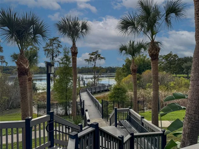 a view of a house with a yard and furniture